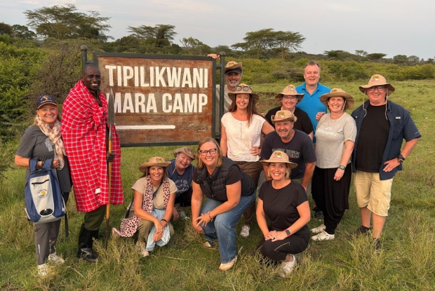 Choice Award winners arrive at the Tipilkwani Mara luxury safari camp in Maasai Mara. Front row (L-R): Susie Potter (The Africa Safara Co.), local Maasai guide, Monique Hulsman (Ucango Travel & Cruise Centre), Mary Boxsell (Mudgee Travel and Cruise), Cathy Hewett (Tewantin Travel) and Robyn Mitchell (Travellers Choice). Back row (L-R): Chip Popescu (Select World Travel), Trinity Hastwell (Hastwell Travel & Cruise), Phil Dalley (Travel Makers), Tania Allen (Oliver Travel), Richard van Schouwen (Kawana Waters Travel), Leah Mullen (Tailor Made Travel Mt Gambier) and James Cracknell (Windsong Travel).